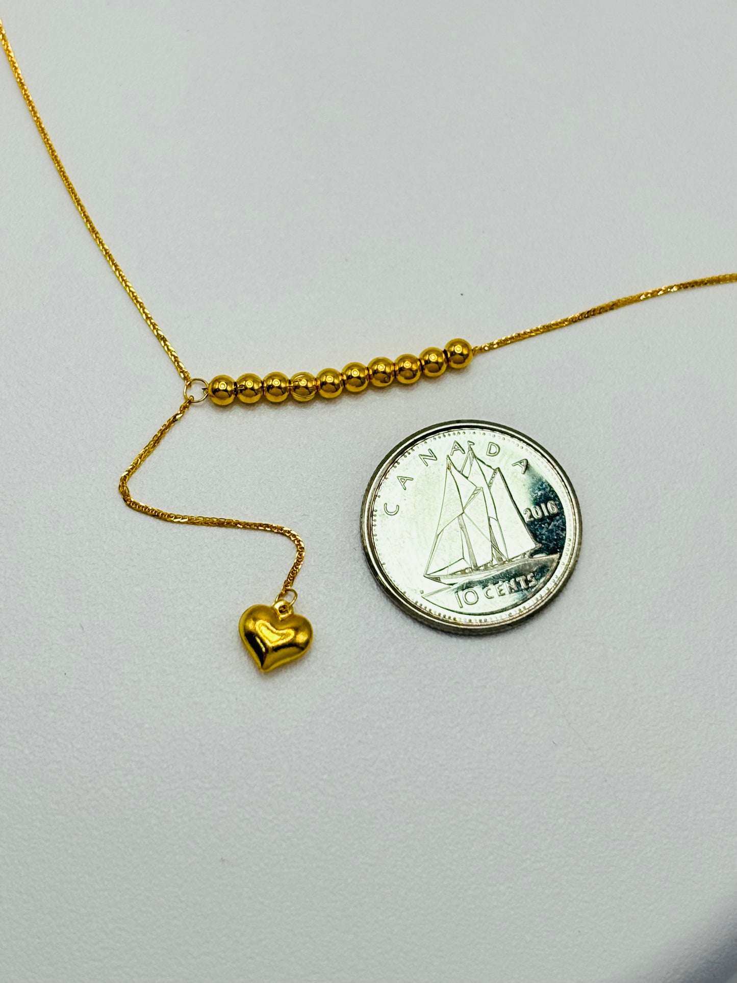 18K Gold Running Ball with Heart Necklace