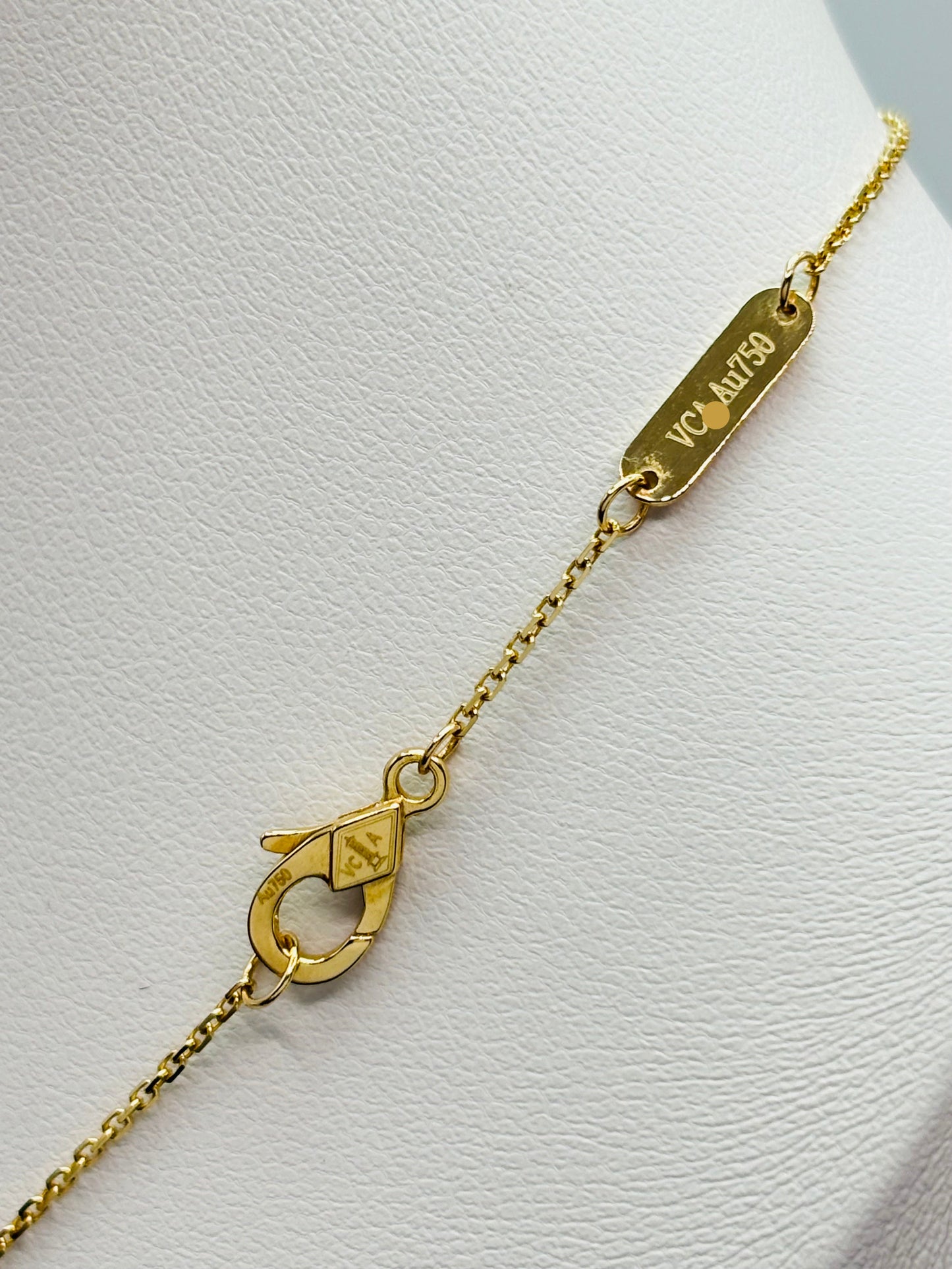 Gold bracelet with a clasp on a white background