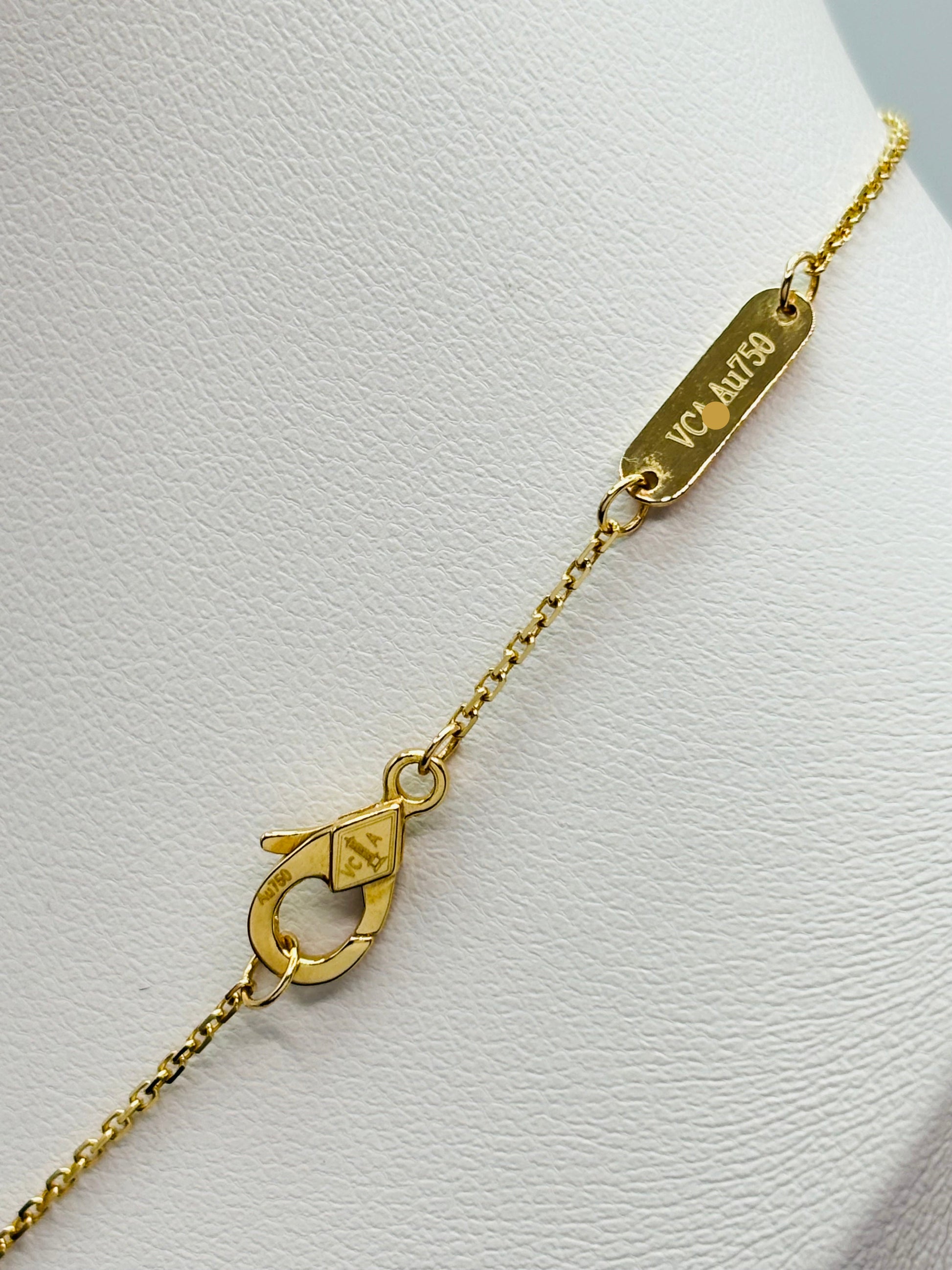 Gold bracelet with a clasp on a white background